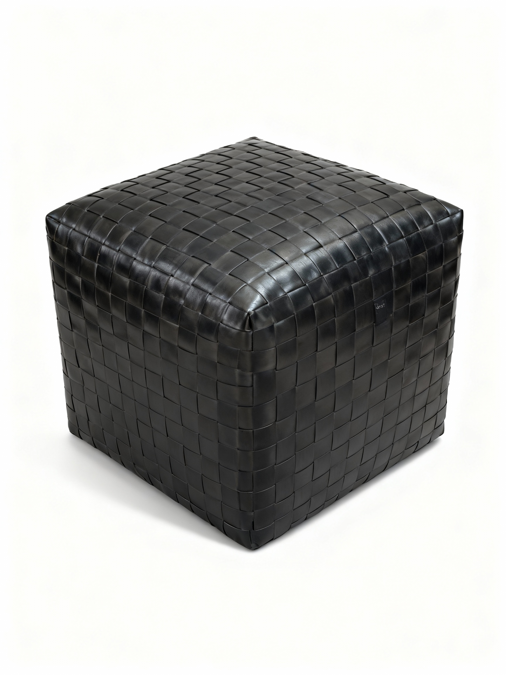 CUCO square ottoman (50x50cm) entirely wrapped in spectacular black full-grain woven leather, embodying Italian artisanal craftsmanship