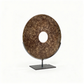 Chinese Bi disc sculpture in earthen speckled patina on a matte black metal stand, 30 cm