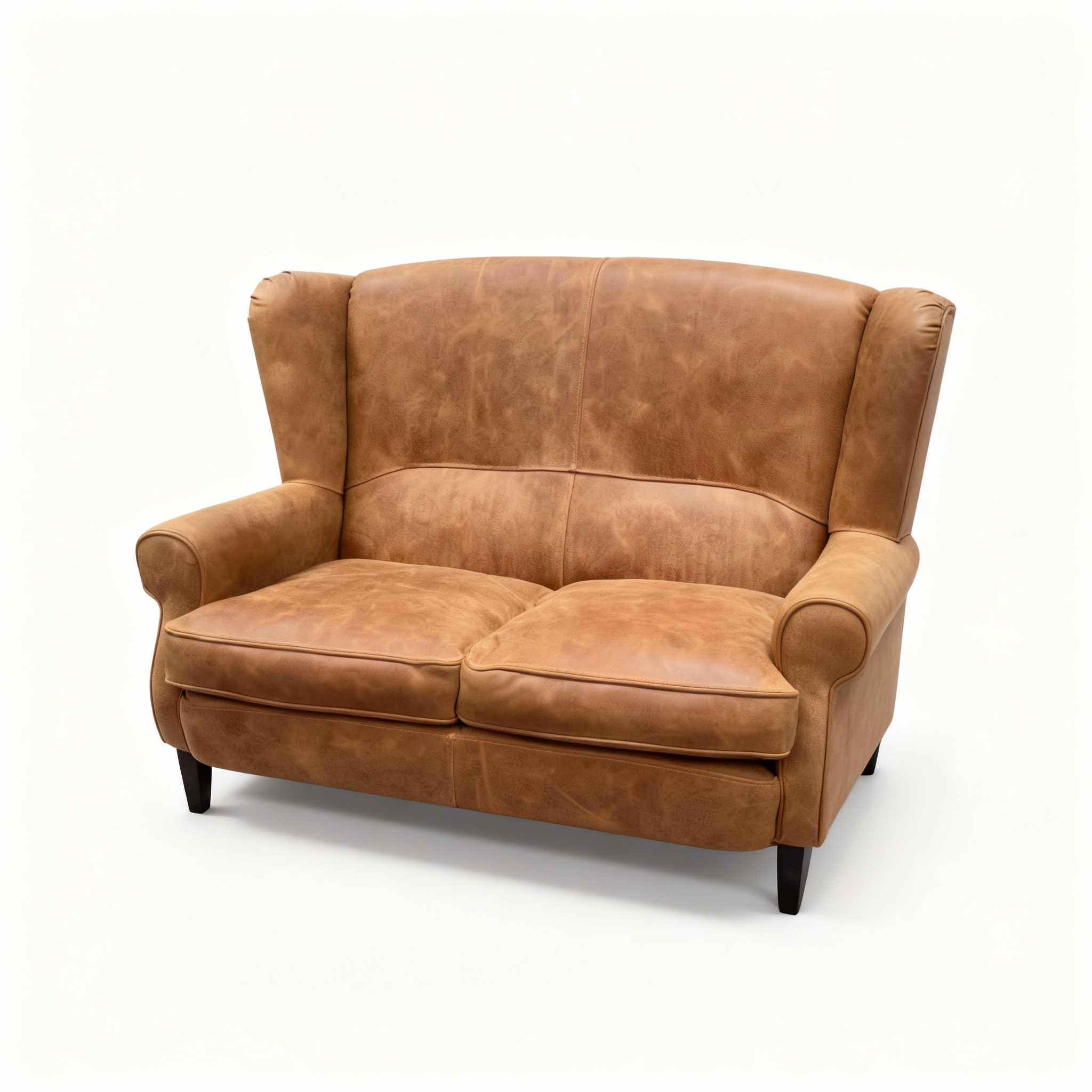 "Clint" compact 2-seater wingback sofa upholstered in warm caramel-toned suede-effect leather, featuring a high backrest and rolled armrests in a classic club style.