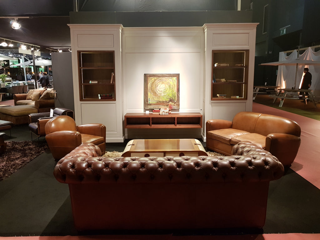 "First" XXL modular TV wall unit (394cm) featuring white outer structures, cherry wood interiors, side display columns, and integrated LED lighting