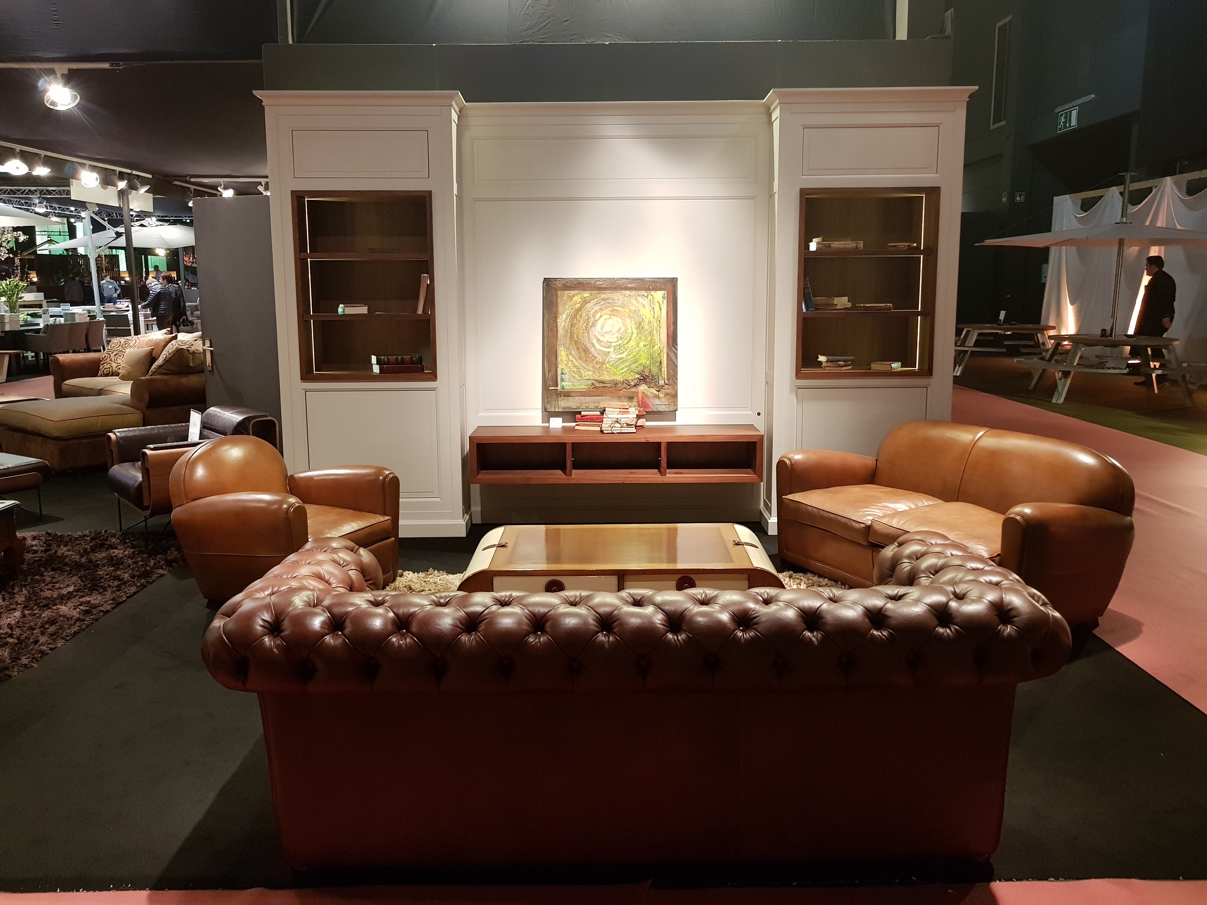 "First" XXL modular TV wall unit (394cm) featuring white outer structures, cherry wood interiors, side display columns, and integrated LED lighting