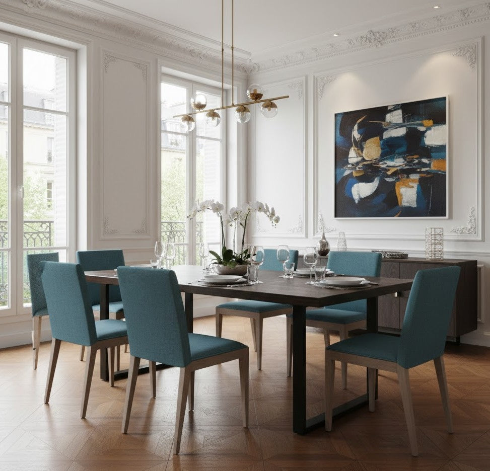 Modern "Lagon Bleu" dining chair with a light Iberian walnut wood frame and upholstered in a soothing blue-green textile. Available in a version with armrests and one without.