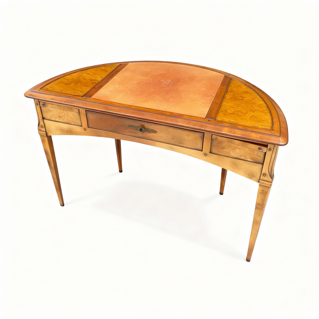 Elegant Louis XVI style half-moon writing desk made of warm cherrywood, featuring tapered legs, brass fittings, and a top covered with genuine leather.