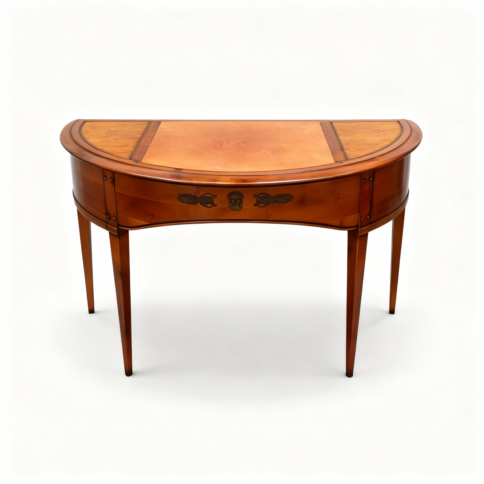 Elegant Louis XVI style half-moon writing desk made of warm cherrywood, featuring tapered legs, brass fittings, and a top covered with genuine leather.