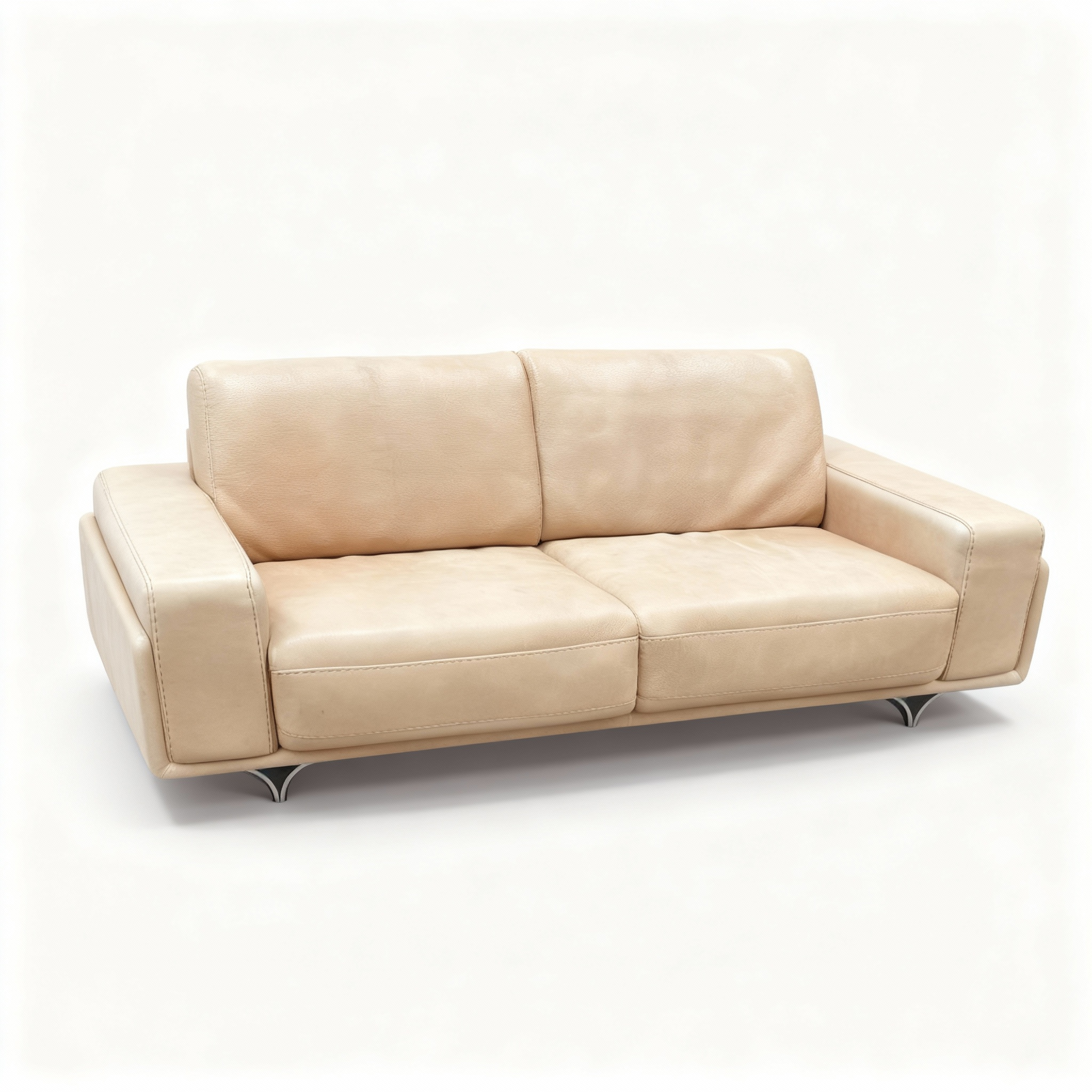 Contemporary "Metropolitan" sofa upholstered in sand-tone full-grain leather, featuring a sleek, low-profile design and signature polished chrome floating legs.