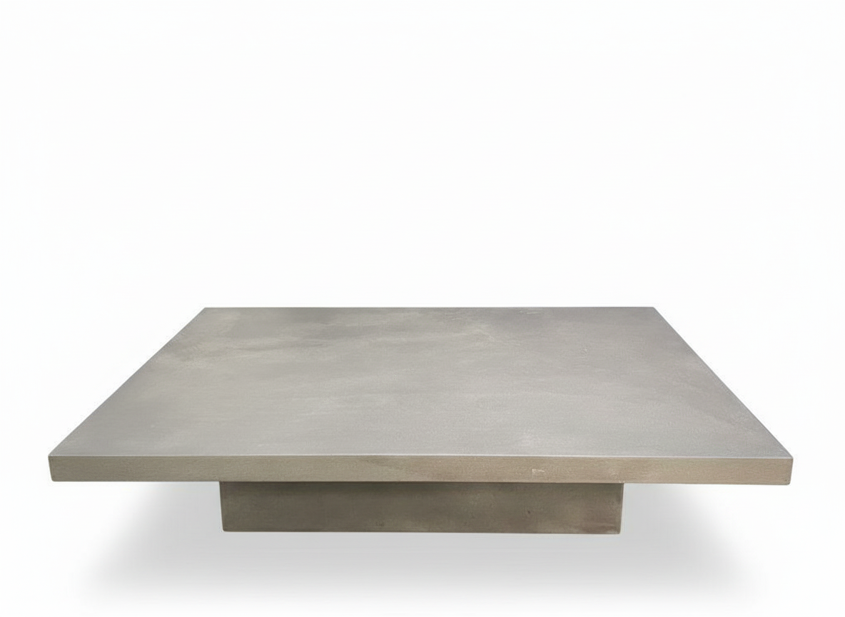Minimalist monolithic coffee table (130x90x30cm) with a matte grey concrete-effect finish, ideal for modern living spaces