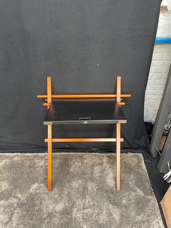 Nomade foldable writing desk in brown cherry wood with a black tabletop and compact design