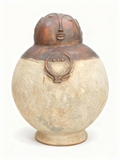 Primitive face sculptural terracotta vessel with open top and ancestral textured finish
