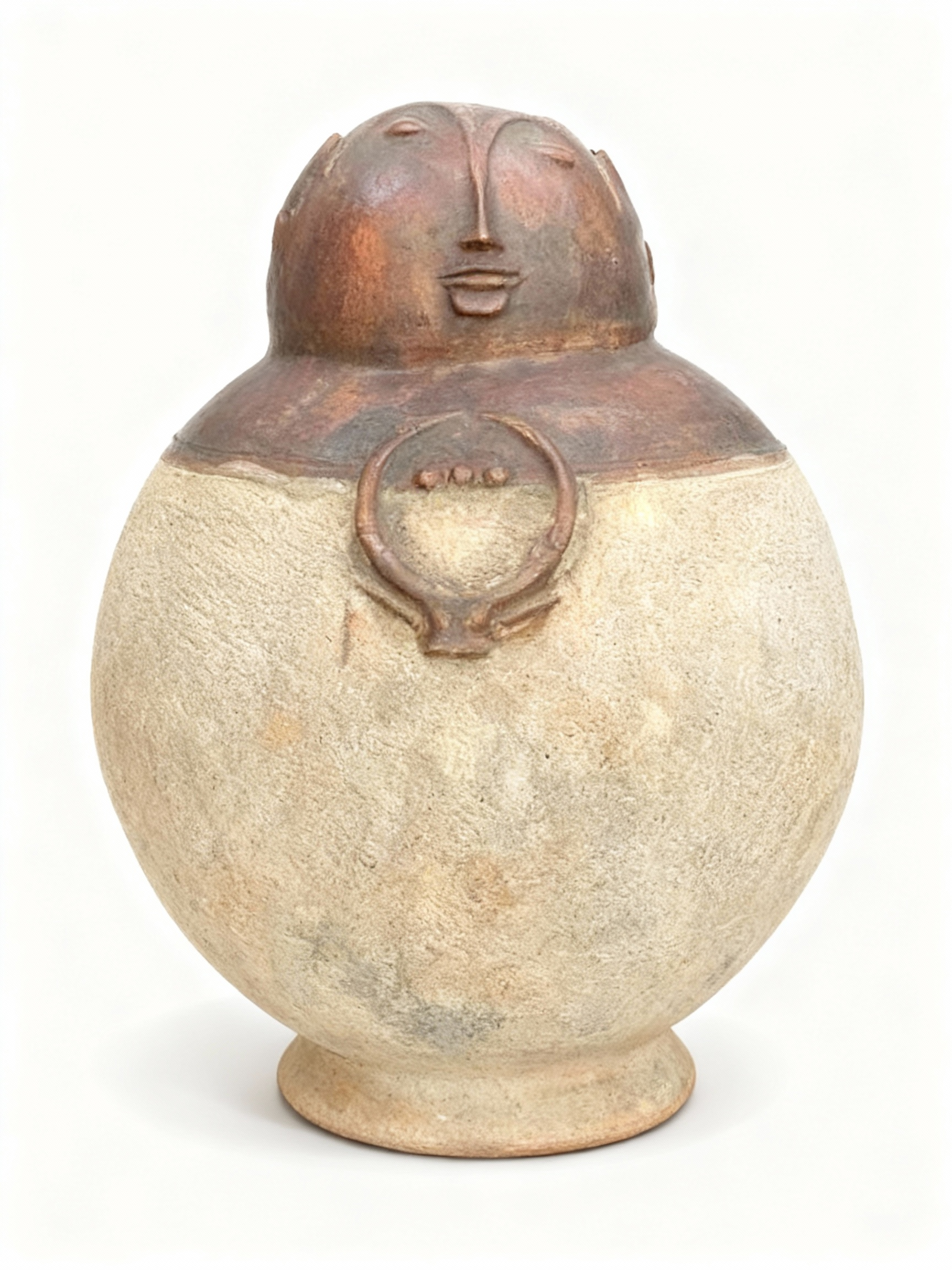 Sculptural terracotta vessel with primitive face lid that opens for secret storage, featuring a raw, textured beige and rust brown patina