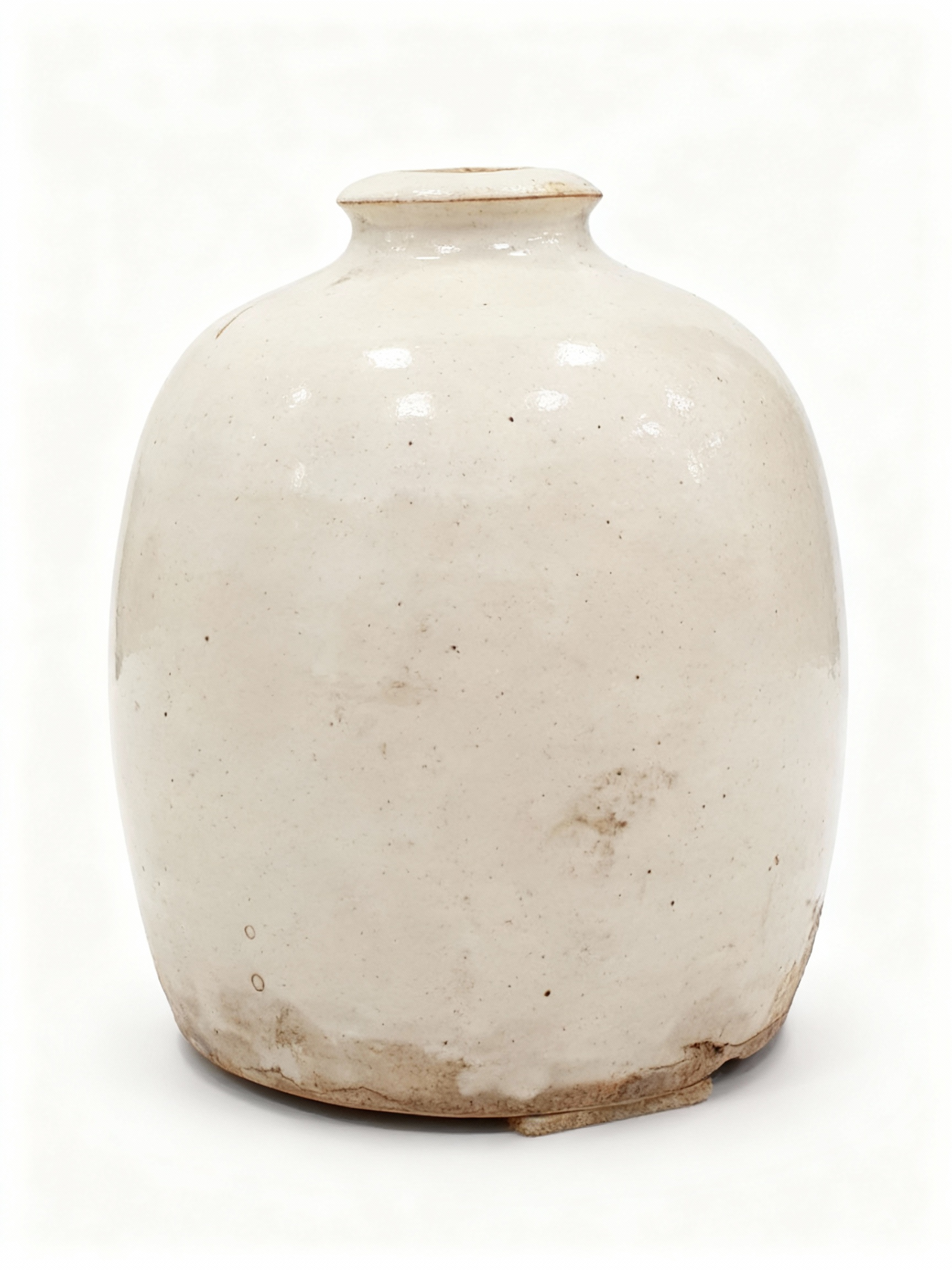 RUSTIQUE ceramic vase with round, squat shape and thick, off-white/cream glaze, featuring an authentic, imperfect, Wabi-Sabi finish