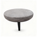 Round pouf coffee table in taupe velvet on a black steel base