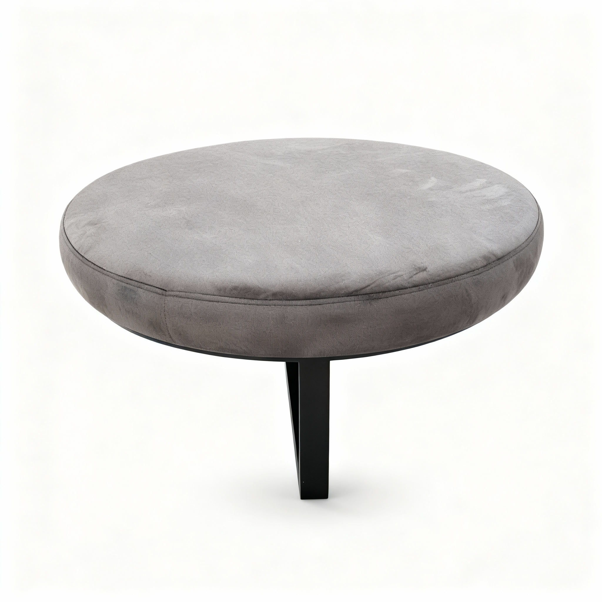 Round hybrid coffee table/pouf (70cm diameter) with a generously padded top upholstered in luxurious taupe velvet, resting on a slender black steel base