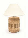 Rustic table lamp with a solid carved aged wood base and ecru conical shade