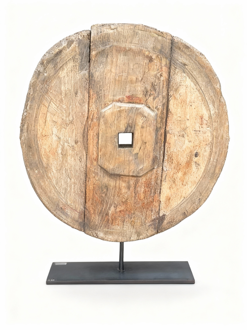 Antique patinated wood cart wheel sculpture on a black metal stand, 55 cm