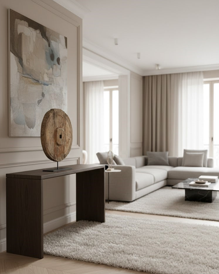 Large decorative wheel (55cm diameter) of patinated antique wood on a modern black metal base