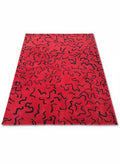 Modern short-pile rug 170x240cm in deep red with bold abstract black patterns