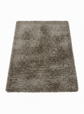 Tapis rectangulaire shaggy (poils longs) de grande taille, couleur brun-taupe chiné, mélange de fibres claires et foncées. Texture très épaisse et moelleuse. Dimensions 250x350cm.
