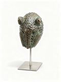 Tribal feline head sculpture in bronze with verdigris patina on a modern stand