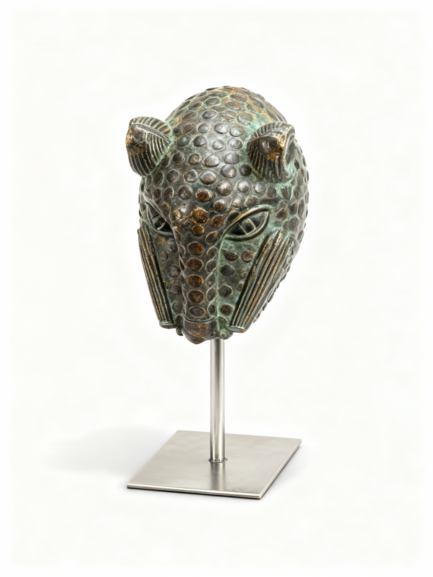 Bronze feline head sculpture (panther/leopard) with scaly texture and verdigris patina on a modern minimalist metal pedestal