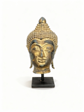 Vintage gilded brass Buddha head sculpture on stand with rich patinated finish